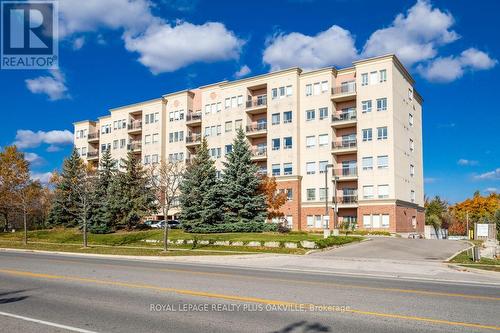 403 - 1499 Nottinghill Gate, Oakville, ON - Outdoor With Facade