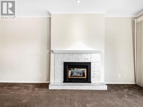 7801 Spartan Drive Unit# 116, Osoyoos, BC - Indoor Photo Showing Living Room With Fireplace