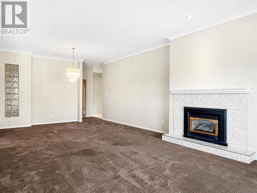 7801 Spartan Drive Unit# 116, Osoyoos, BC - Indoor Photo Showing Living Room With Fireplace