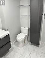 Bathroom featuring vanity and toilet - 