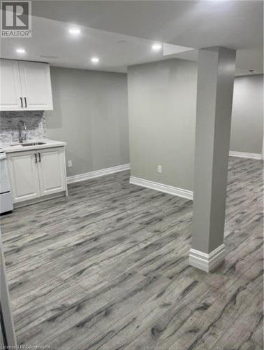 Basement with light wood-type flooring and sink - 155 Norfolk Avenue, Cambridge, ON - Indoor