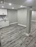 Basement with light wood-type flooring and sink - 155 Norfolk Avenue, Cambridge, ON  - Indoor 