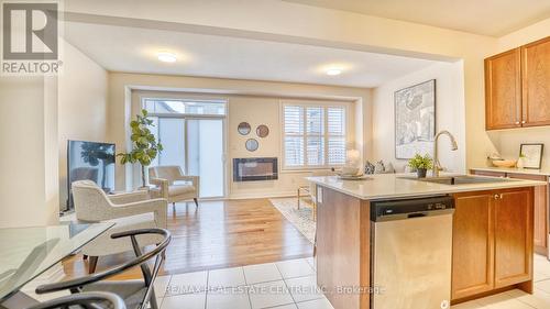 160 Christine Elliott Avenue, Whitby, ON - Indoor Photo Showing Kitchen With Fireplace