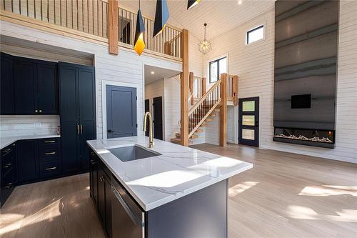 12 Lakespeak Crescent, Hillside Beach, MB - Indoor Photo Showing Kitchen With Fireplace