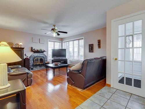 Salon - 6025 Rue Sauvageau, Laval (Auteuil), QC - Indoor Photo Showing Living Room With Fireplace