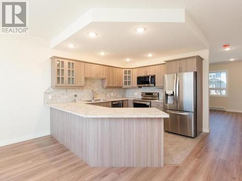 215 Witch Hazel Drive, Whitehorse, YT - Indoor Photo Showing Kitchen With Stainless Steel Kitchen