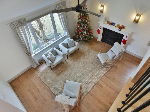 Den - 175 Rue Maxime, Saint-Jean-Sur-Richelieu, QC - Indoor With Fireplace