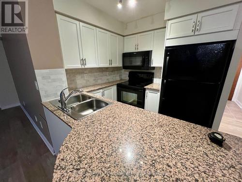 307 - 18 Kenaston Gardens, Toronto, ON - Indoor Photo Showing Kitchen With Double Sink