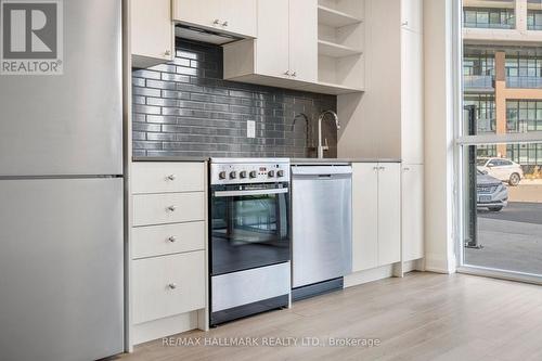 118 - 50 George Butchart Drive, Toronto, ON - Indoor Photo Showing Kitchen