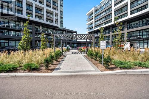 118 - 50 George Butchart Drive, Toronto, ON - Outdoor With Facade