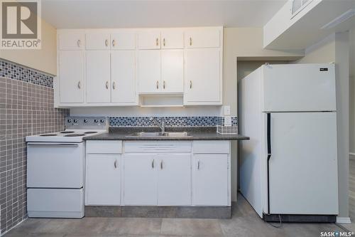 1617 19Th Street W, Saskatoon, SK - Indoor Photo Showing Kitchen With Double Sink