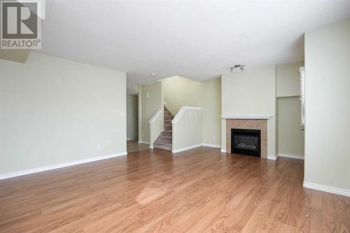 1, 240 Laffont Way, Fort Mcmurray, AB - Indoor Photo Showing Living Room With Fireplace