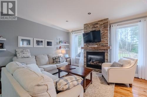 22 Micnoel Place, Pouch Cove, NL - Indoor Photo Showing Living Room With Fireplace