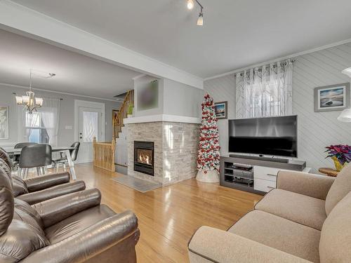 Living room - 6039 Av. Royale, L'Ange-Gardien, QC - Indoor Photo Showing Living Room With Fireplace