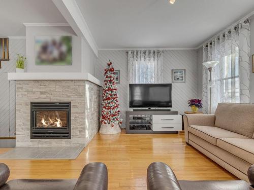 Living room - 6039 Av. Royale, L'Ange-Gardien, QC - Indoor Photo Showing Living Room With Fireplace