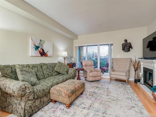 204-2380 Brethour Ave, Sidney, BC - Indoor Photo Showing Living Room With Fireplace