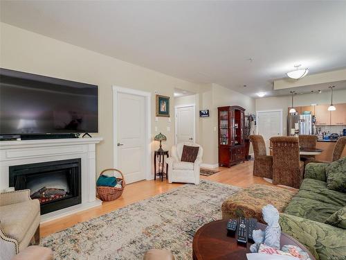 204-2380 Brethour Ave, Sidney, BC - Indoor Photo Showing Living Room With Fireplace