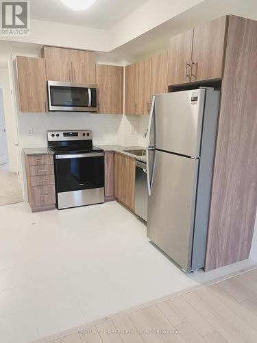 18 - 155 Tapscott Road, Toronto, ON - Indoor Photo Showing Kitchen With Stainless Steel Kitchen