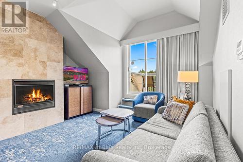 477 - 220 Gord Canning Drive, Blue Mountains (Blue Mountain Resort Area), ON - Indoor Photo Showing Living Room With Fireplace