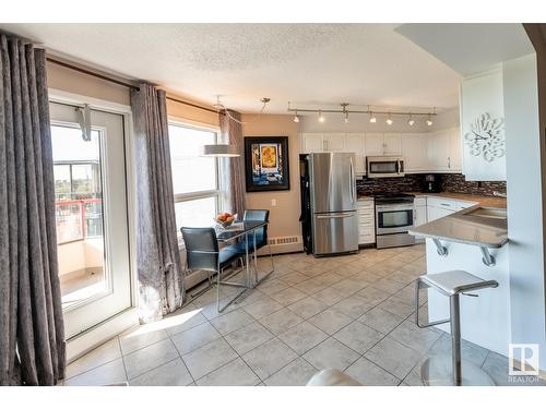 #703 12319 Jasper Av Nw, Edmonton, AB - Indoor Photo Showing Kitchen