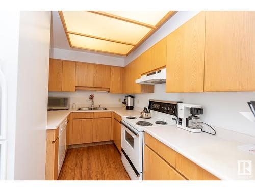 #703 12319 Jasper Av Nw, Edmonton, AB - Indoor Photo Showing Kitchen With Double Sink