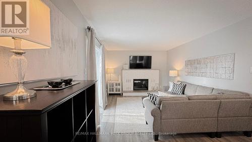 7 Beckett Avenue, East Gwillimbury, ON - Indoor Photo Showing Living Room With Fireplace