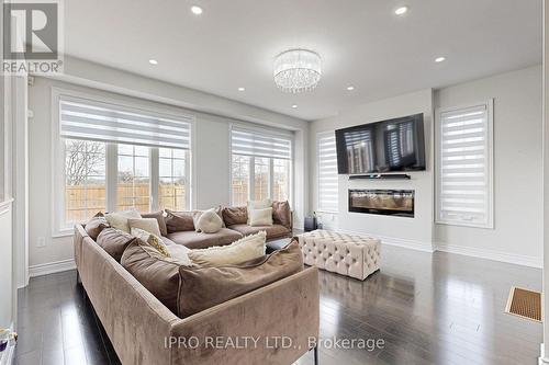 4 Brigham Avenue, Hamilton, ON - Indoor Photo Showing Living Room With Fireplace