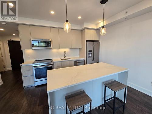 406 - 195 Hunter Street E, Peterborough (Ashburnham), ON - Indoor Photo Showing Kitchen With Stainless Steel Kitchen With Upgraded Kitchen