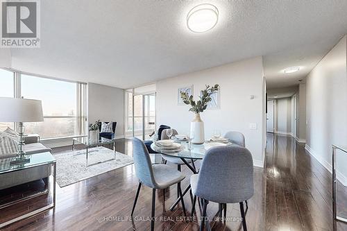 606 - 2460 Eglinton Avenue E, Toronto, ON - Indoor Photo Showing Living Room