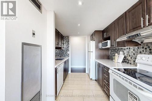 606 - 2460 Eglinton Avenue E, Toronto, ON - Indoor Photo Showing Kitchen