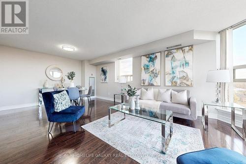 606 - 2460 Eglinton Avenue E, Toronto, ON - Indoor Photo Showing Living Room