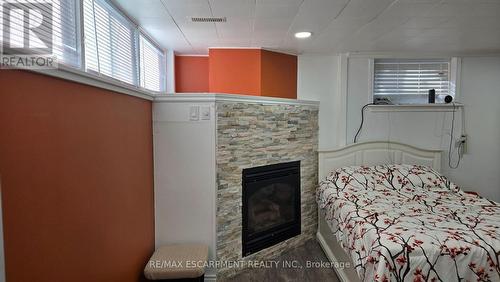 208 West 19Th Street, Hamilton, ON - Indoor Photo Showing Bedroom With Fireplace