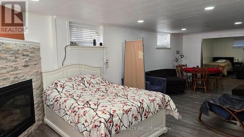 208 West 19Th Street, Hamilton, ON - Indoor Photo Showing Bedroom With Fireplace