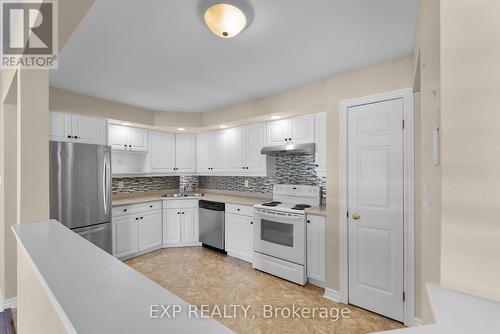 306B - 1061 Vansickle Road N, St. Catharines (453 - Grapeview), ON - Indoor Photo Showing Kitchen