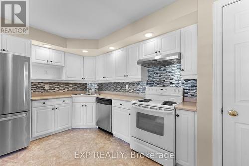 306B - 1061 Vansickle Road N, St. Catharines (453 - Grapeview), ON - Indoor Photo Showing Kitchen