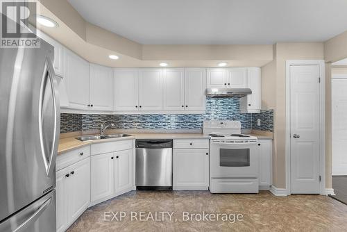 306B - 1061 Vansickle Road N, St. Catharines (453 - Grapeview), ON - Indoor Photo Showing Kitchen With Double Sink