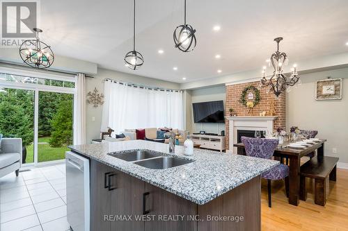 37 - 171 Snowbridge Way, Blue Mountains, ON - Indoor Photo Showing Kitchen With Fireplace With Double Sink