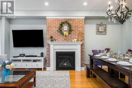 37 - 171 Snowbridge Way, Blue Mountains, ON - Indoor Photo Showing Living Room With Fireplace