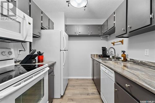 305 311 Tait Crescent, Saskatoon, SK - Indoor Photo Showing Kitchen With Double Sink