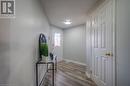 Doorway with wood-type flooring and a textured ceiling - 83 Bridlewreath Street, Kitchener, ON  - Indoor Photo Showing Other Room 