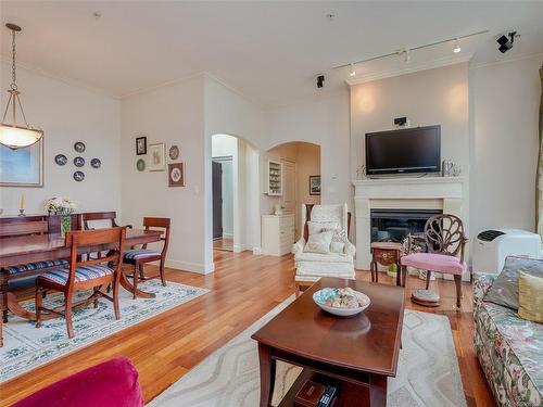 409-1620 Mckenzie Ave, Saanich, BC - Indoor Photo Showing Living Room With Fireplace