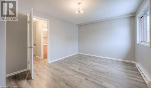 Empty room featuring light hardwood / wood-style floors - 1200 Courtland Avenue E Unit# 27, Kitchener, ON - Indoor Photo Showing Other Room