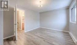 Empty room featuring light hardwood / wood-style floors - 