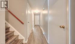 Corridor featuring light hardwood / wood-style flooring - 