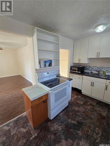 813 Souris Avenue, Weyburn, SK - Indoor Photo Showing Kitchen With Double Sink