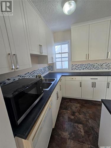 813 Souris Avenue, Weyburn, SK - Indoor Photo Showing Kitchen With Double Sink