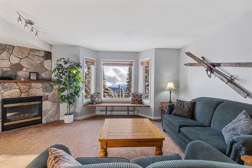 211-225 Kettle View Road, Big White, BC - Indoor Photo Showing Living Room With Fireplace