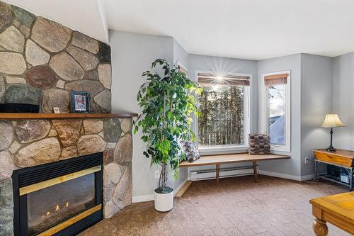 211-225 Kettle View Road, Big White, BC - Indoor Photo Showing Living Room With Fireplace