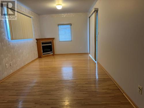 3310 Lilac Crescent, Trail, BC - Indoor Photo Showing Other Room With Fireplace