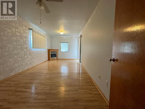 3310 Lilac Crescent, Trail, BC - Indoor Photo Showing Other Room With Fireplace